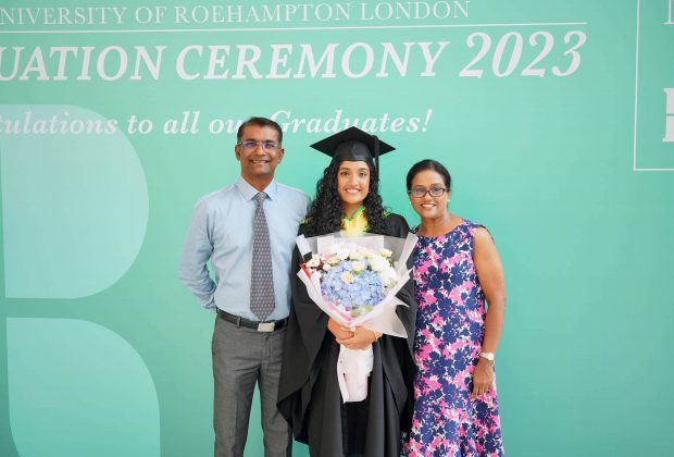 An MDIS graduate posing with her parents for a photo at the MDIS- University of Roehampton London Graduation Ceremony 2023.