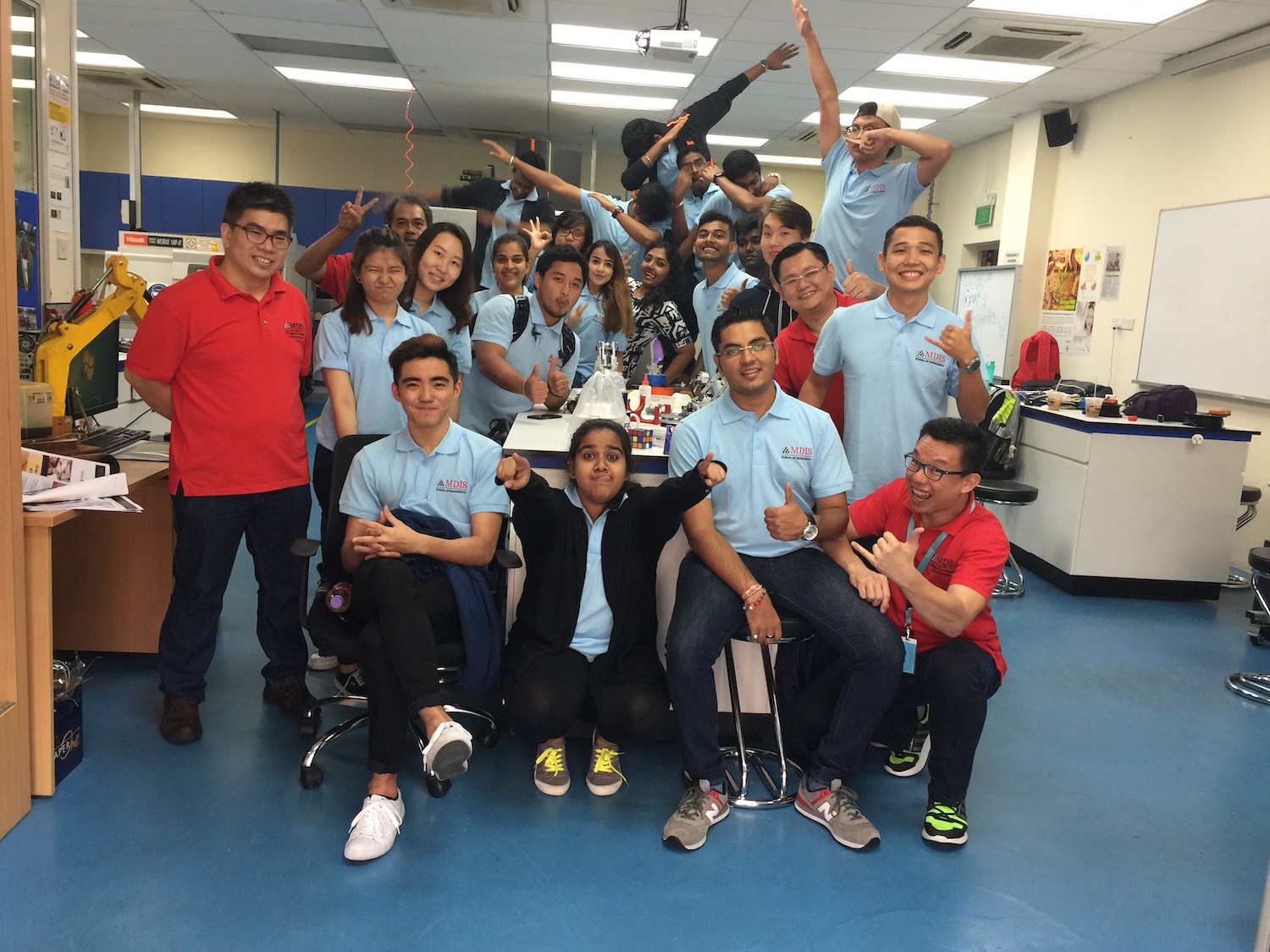 MDIS College students pose for a picture in the engineering lab.